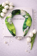 Green and White Silk Scarf with Floral Print and Pearl Necklace